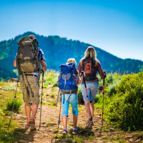 family on camping holiday with vacuum storage bags vela